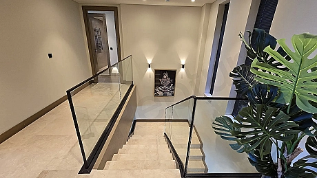 Elegant and aesthetically designed interior staircase within a modern villa.