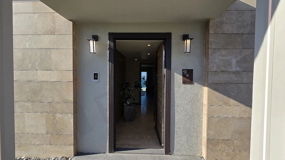 Stylish entrance door and hallway area of a modern design villa apartment.