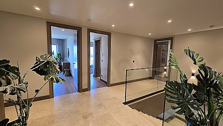 Modern and spacious hallway interior of a luxury villa with bright lighting