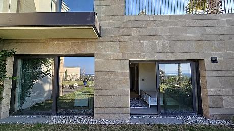 Exterior view of a luxury and modern architecture villa located on the waterfront in Bodrum.