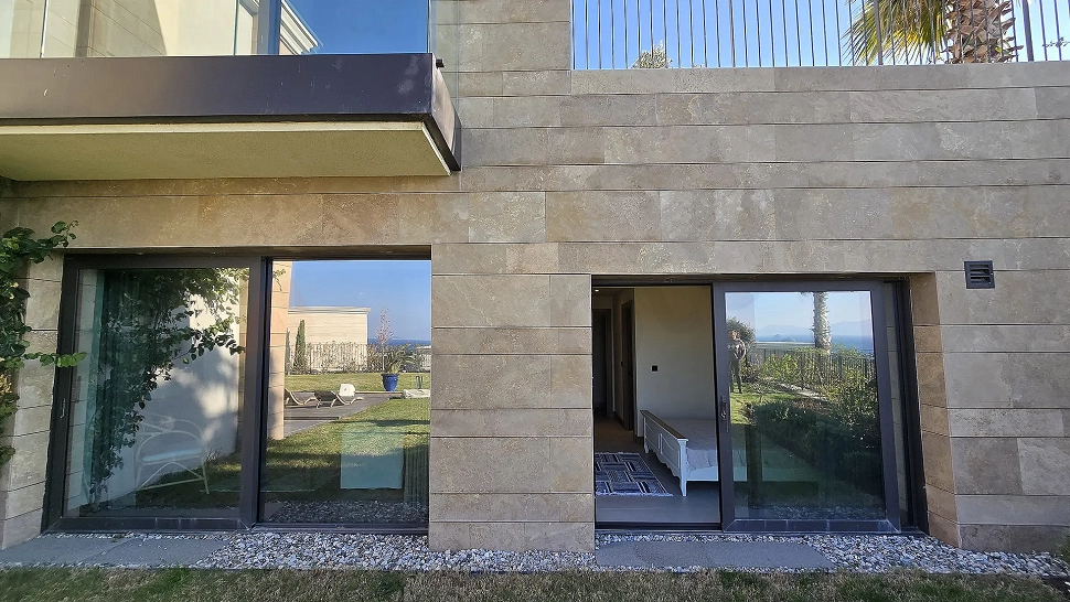 Exterior view of a luxury and modern architecture villa located on the waterfront in Bodrum.