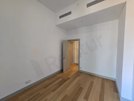 View of a spacious and bright bedroom in a modern residence project.