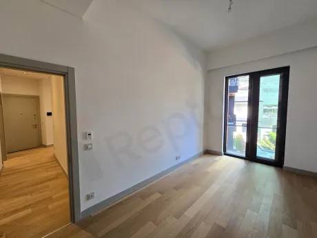 A modern design, spacious bedroom with large windows.