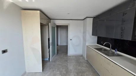 Modern kitchen area with spacious countertops and cabinets.