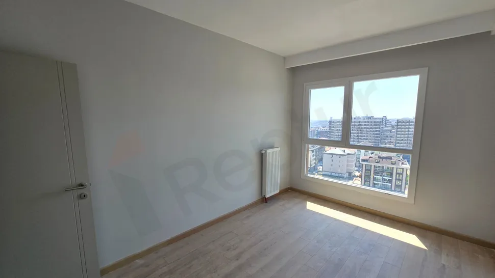 Spacious and modern empty bedroom with natural lighting in a luxury duplex apartment in Beylikduzu, Istanbul.