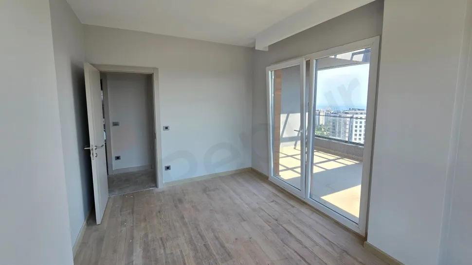 Modern, spacious and bright bedroom area.