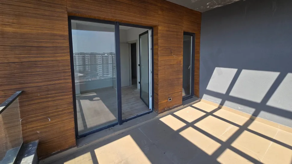 Spacious balcony of a duplex apartment with a city view located in Beylikdüzü, Istanbul.