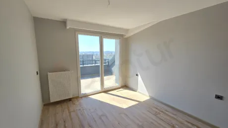 View of a spacious and bright bedroom with natural daylight