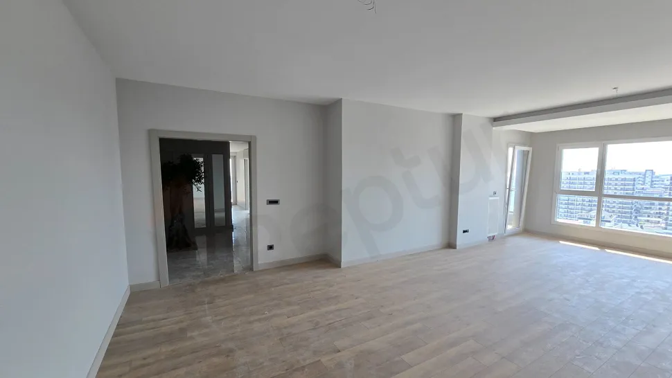 General view of a spacious and modern sitting room.