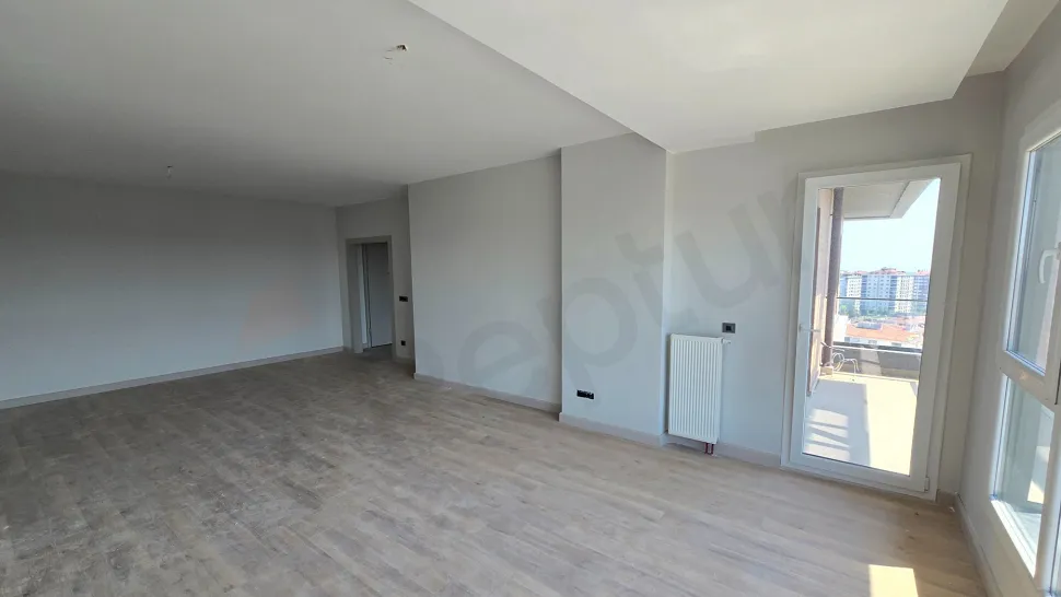 Spacious and bright living room interior of a modern duplex apartment with natural light.