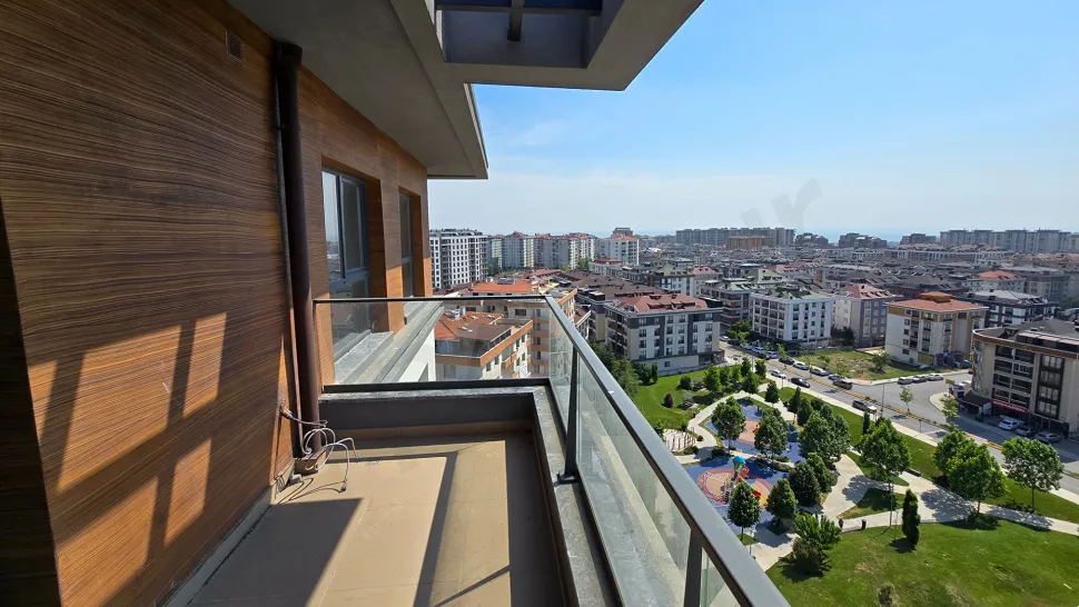 Detailed view of a spacious and modern balcony with a city view.