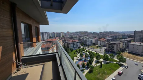 Balcony view of a modern and spacious duplex apartment with a city view.