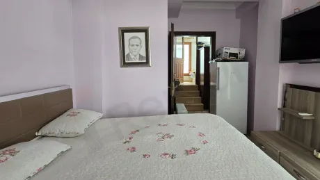 Spacious and bright bedroom interior view.