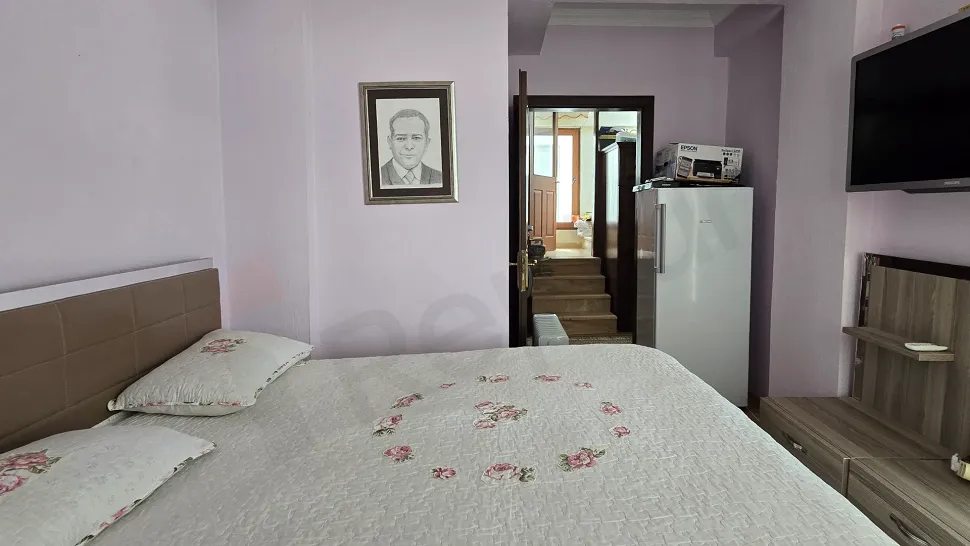 Spacious and bright bedroom interior view.