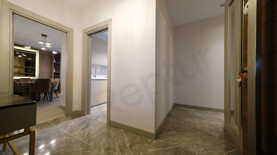 Interior view of a furnished apartment corridor.