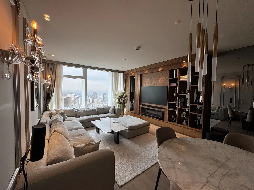 View of a spacious and bright living room decorated with modern and stylish furniture.