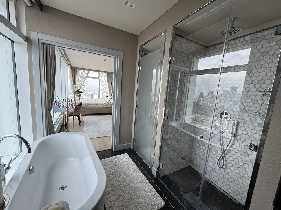 Interior view of a modern and stylishly designed, spacious and bright bathroom.