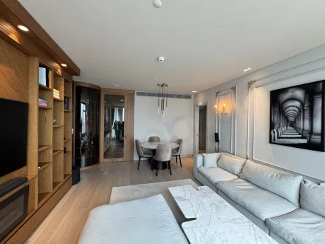 A spacious and bright living room image furnished with modern furniture and large windows in Şişli.
