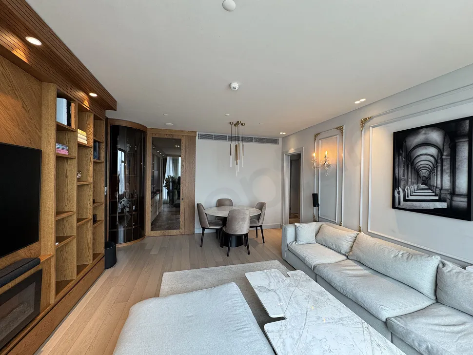 A spacious and bright living room image furnished with modern furniture and large windows in Şişli.