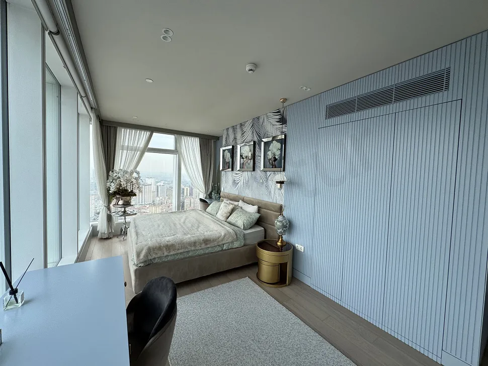 A modern designed, furnished, and spacious bedroom view.