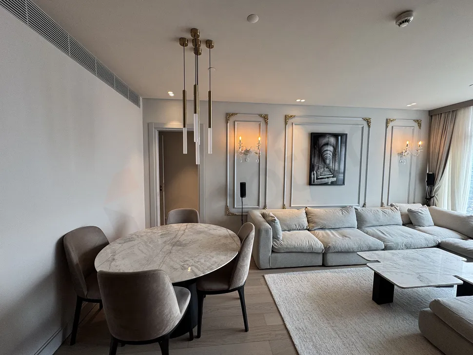 A bright and spacious living room visual decorated with modern furniture and large windows.