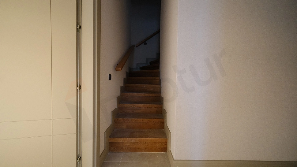 Interior photograph of a spacious and bright hallway.