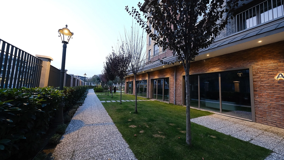 Image of a duplex house with a large garden.