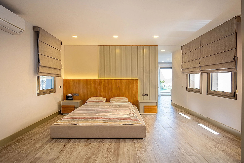 Spacious and bright bedroom.
