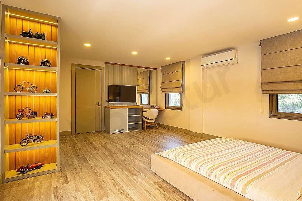 Spacious and bright bedroom interior.