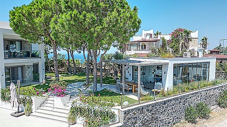 Image of a mansion with a spacious garden.