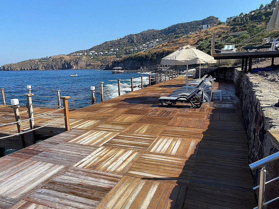 Image of a mansion for sale with a private beach view in Bodrum.