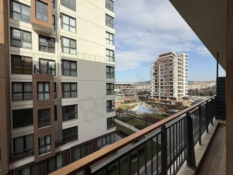 Spacious and modern balcony view of a contemporary apartment.