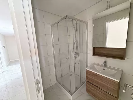 Modernly designed, spacious and stylish bathroom area.