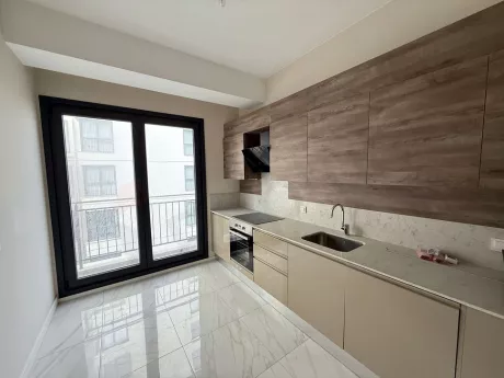 Modernly designed, spacious and bright kitchen area.