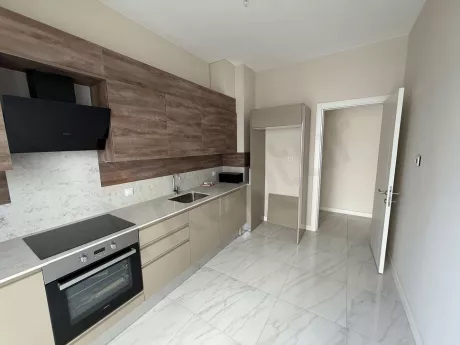 Modernly designed, spacious, and bright kitchen area.