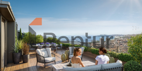 Interior view of a modern 1+1 apartment in Beşiktaş with Istanbul view from wide windows.