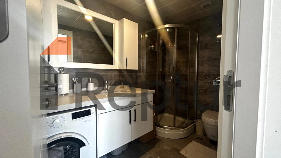 Modern design 1+1 apartment with large windows in the central area of Istanbul for sale