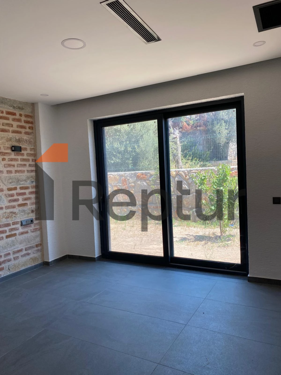 Cottage in a modern interior made of natural stone in Bodrum